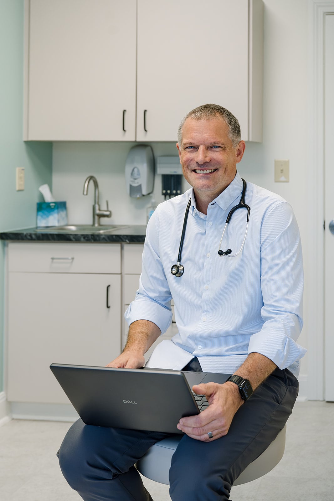 Dr. Lee Patrick Finklea, Jr. in an exam room at Here We Grow Pediatrics